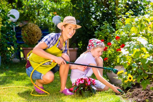 Whitton garden design featuring shrubs, lawn, and paved paths